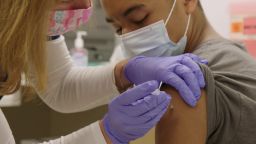 A patient receives the Covid-19 vaccine at office of CNN Hero Dr. Wendy Ross