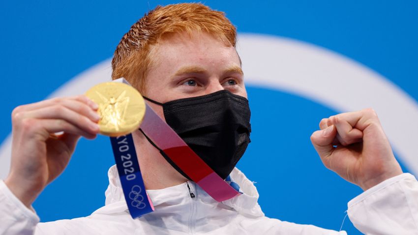 Gold medallist Britain's Tom Dean poses on the podium after the final of the men's 4x200m freestyle relay swimming event during the Tokyo 2020 Olympic Games at the Tokyo Aquatics Centre in Tokyo on July 28, 2021. (Photo by Odd ANDERSEN / AFP) (Photo by ODD ANDERSEN/AFP via Getty Images)