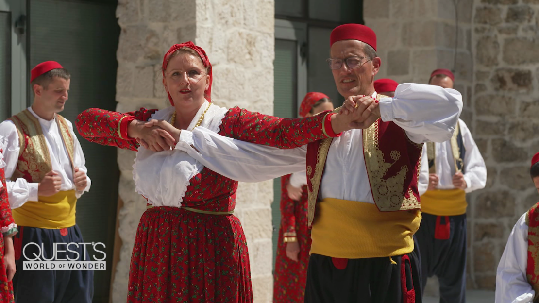 Jelica Čučević shows Richard Quest some traditional dance moves.