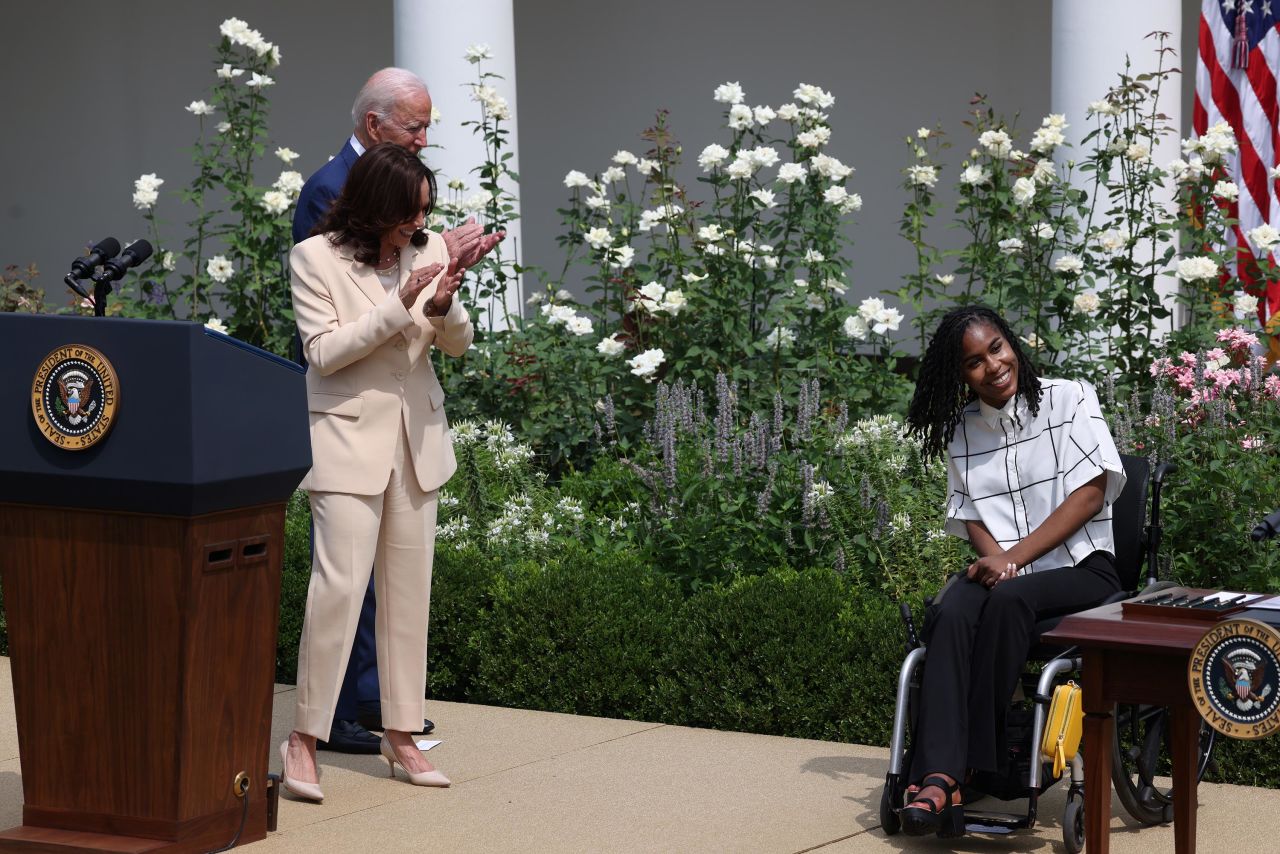 US President Joe Biden and Vice President Kamala Harris applaud with artist Tyree Brown during a White House event celebrating the 31st anniversary of the Americans with Disabilities Act on Monday, July 26.