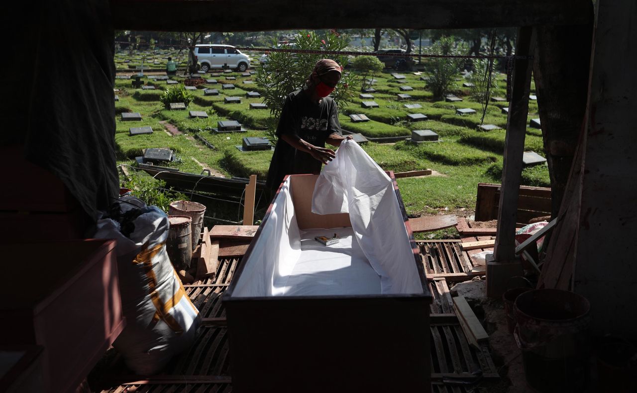 A worker makes a coffin to be used for a Covid-19 victim in Jakarta, Indonesia, on Tuesday, July 27. Indonesia is now <a href="https://www.cnn.com/2021/07/14/asia/indonesia-covid-intl-hnk/index.html" target="_blank">the epicenter for the pandemic in Asia.</a>