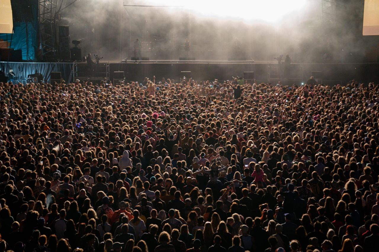 A crowd gathers to watch the rock band Wolf Alice at the Latitude Festival near Southwold, England, on Friday, July 23. The country's Covid-19 restrictions <a href="https://www.cnn.com/2021/07/18/uk/boris-johnson-covid-gamble-freedom-day-intl-gbr-cmd/index.html" target="_blank">were lifted earlier in the week.</a>