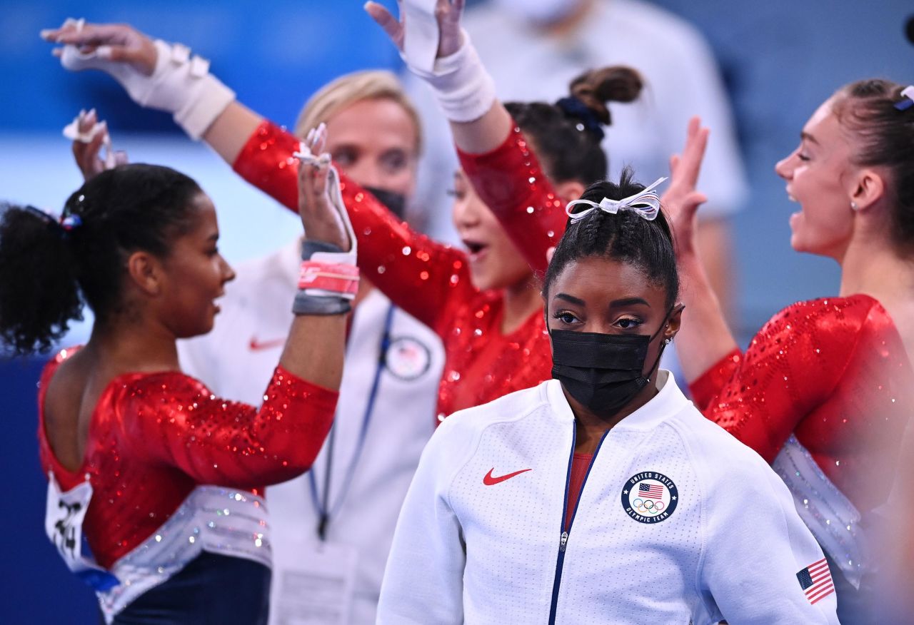 US gymnast <a href="http://www.cnn.com/2019/10/11/sport/gallery/simone-biles/index.html" target="_blank">Simone Biles</a> wears her warm-up gear after <a href="https://www.cnn.com/2021/07/27/sport/simone-biles-tokyo-2020-olympics/index.html" target="_blank">she pulled out of the team all-around competition</a> on Tuesday, July 27. Biles withdrew after stumbling on the vault, Team USA's first apparatus of the night. She cited mental-health concerns for her withdrawal. The Americans went on to win the silver, behind gymnasts representing the Russian Olympic Committee.