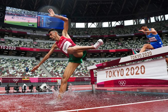 Morocco's Mohamed Tindouft falls while competing in the 3,000-meter steeplechase on July 30.