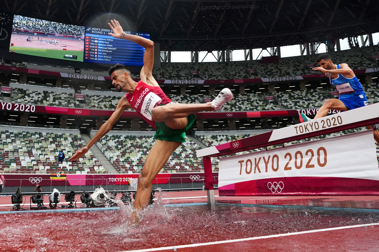 Morocco's Mohamed Tindouft falls while competing in the 3,000-meter steeplechase on July 30.