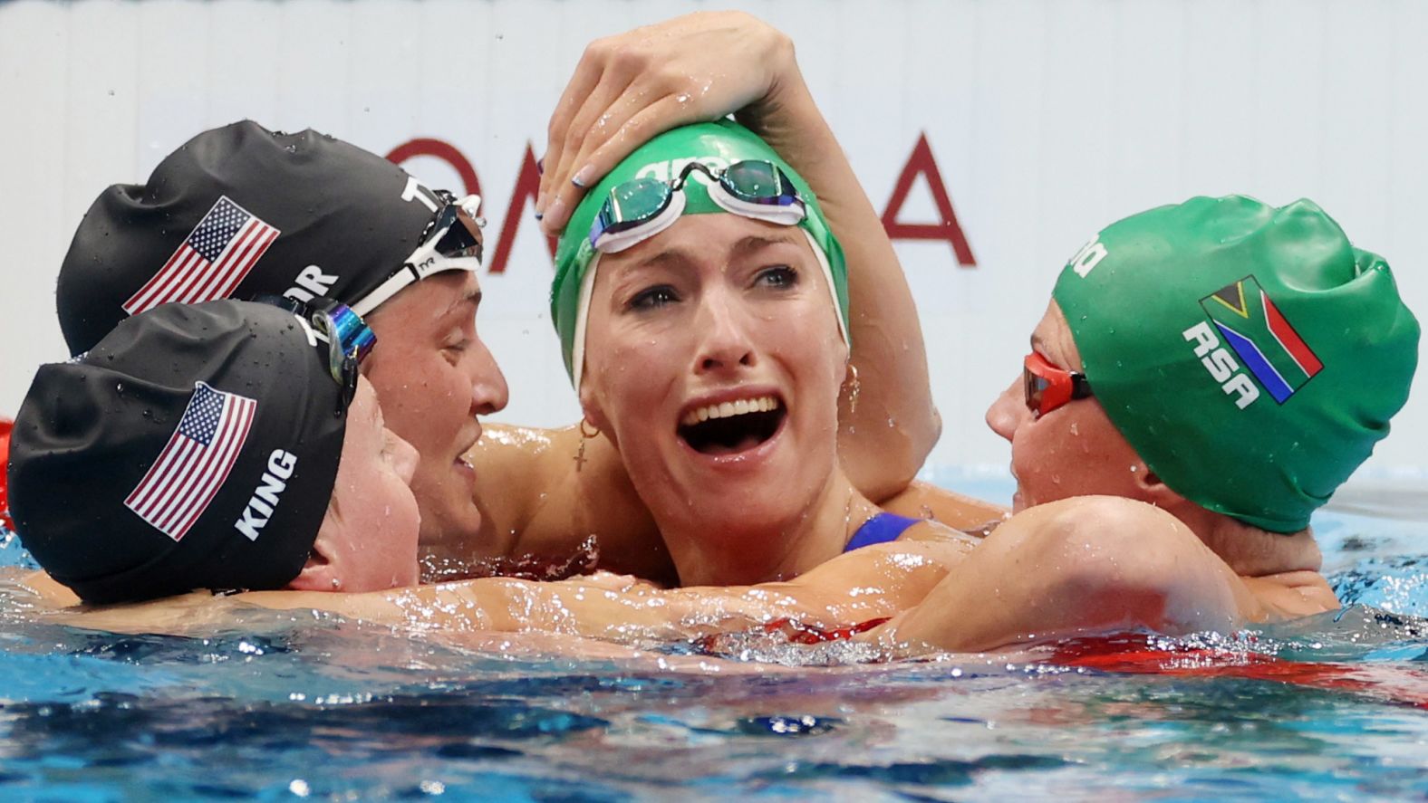 South African swimmer Tatjana Schoenmaker is congratulated by some of her fellow competitors — from left, American Lilly King, American Annie Lazor and South African Kaylene Corbett — after <a href="index.php?page=&url=https%3A%2F%2Fwww.cnn.com%2Fworld%2Flive-news%2Ftokyo-2020-olympics-07-29-21-spt%2Fh_5fc36626ed162977a9a007f5febace8b" target="_blank">winning gold in the 200-meter breaststroke</a> on July 30. She broke the world record, finishing with a time of 2:18.95.