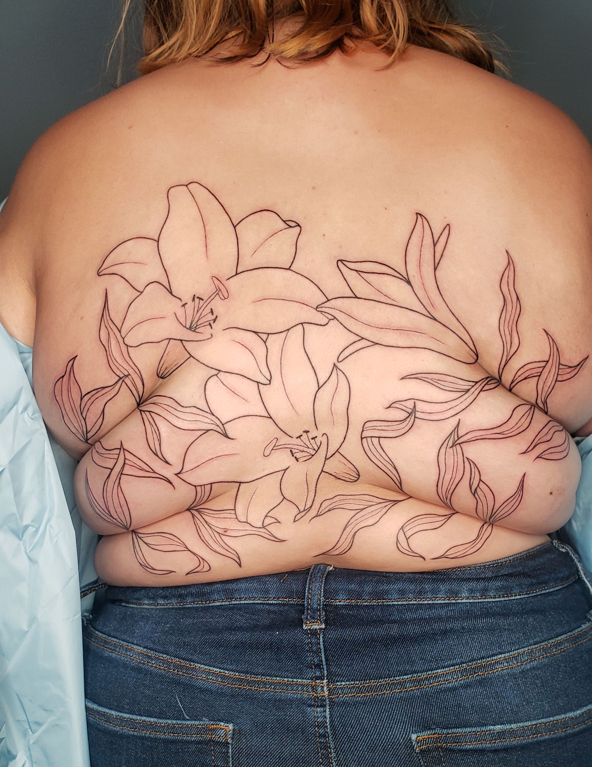 The tattooist creating body-positive 'roll flowers