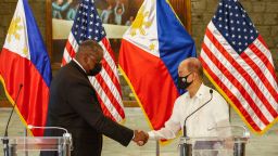 US Defense Secretary Lloyd Austin (L) and Philippines Defense Secretary Delfin Lorenzana (R) shake hands after a bilateral meeting at Camp Aguinaldo military in Manila on July 30, 2021. (Photo by Rolex DELA PENA / POOL / AFP) (Photo by ROLEX DELA PENA/POOL/AFP via Getty Images)