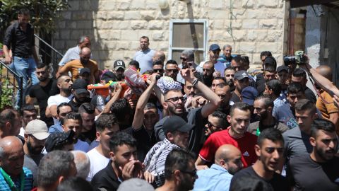 Mourners attend the funeral procession of 12-year-old Mohammad Allamy on Thursday. 