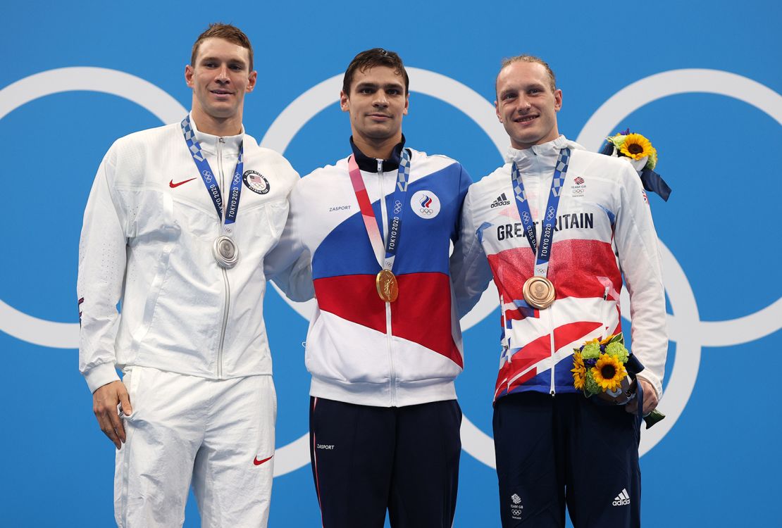 Murphy (left), Rylov (middle) and Greenbank (right) pose on the podium during the medal ceremony for the men's 200m backstroke final.