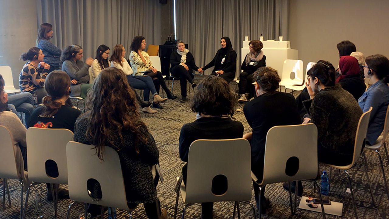 In a pre-pandemic photo, members of the Parents Circle - Families Forum participate in a dialogue meeting. "Everything from the Parents Circle, all the work is always from both sides," Robi Damelin tells CNN. 