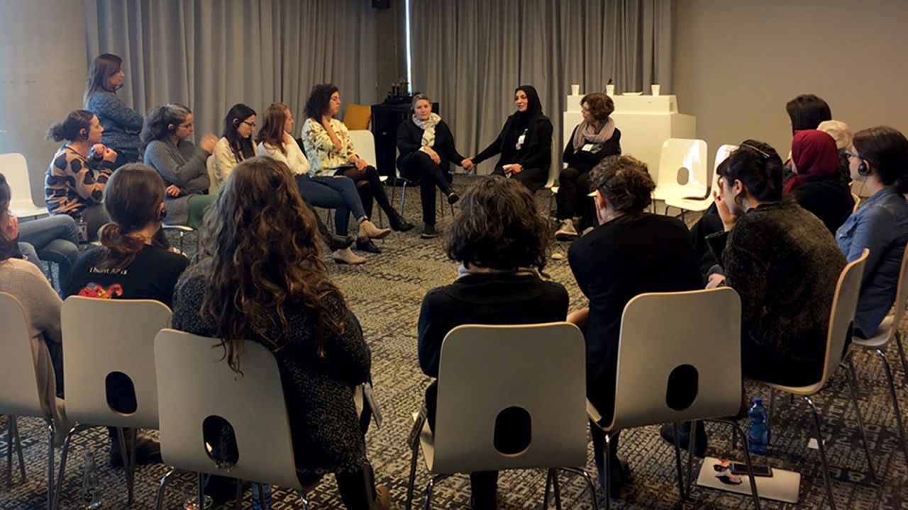 In a pre-pandemic photo, members of the Parents Circle - Families Forum participate in a dialogue meeting. "Everything from the Parents Circle, all the work is always from both sides," Robi Damelin tells CNN.