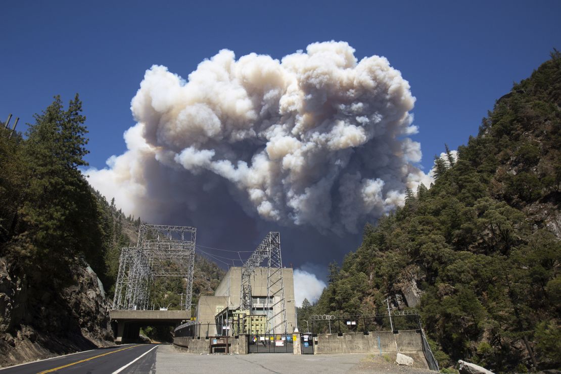 Heavy plumes of smoke billow from the Dixie Fire above the Plumas National Forest near the PG&E Rock Creek Power House on July 21.