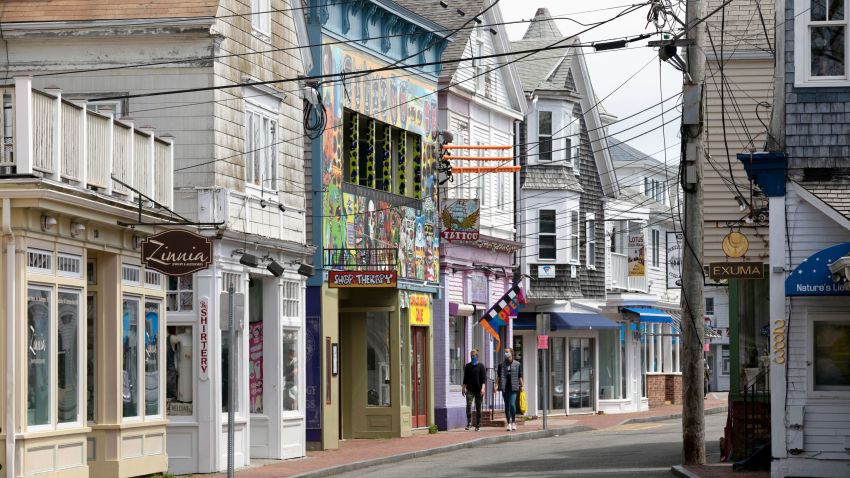 Closed retail stores line the usually crowded Commercial Street, Monday, May 25, 2020, in Provincetown, Mass. (AP Photo/Michael Dwyer)