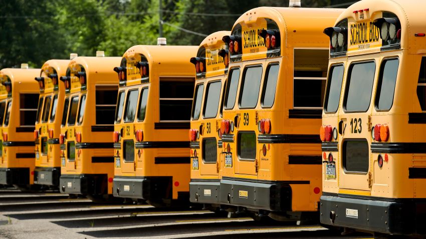 A line of school buses in August 2020.