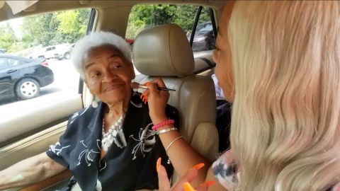 Martha Tucker getting her make-up done before going into a bridal shop.