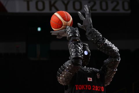 A robot shoots a free throw during halftime of a women's basketball game between Belgium and Puerto Rico on July 30. 