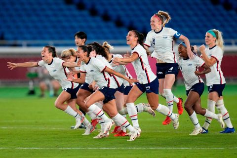 US players celebrate after they defeated the Netherlands in a penalty shootout July 30 to advance to the semifinals in women's football.