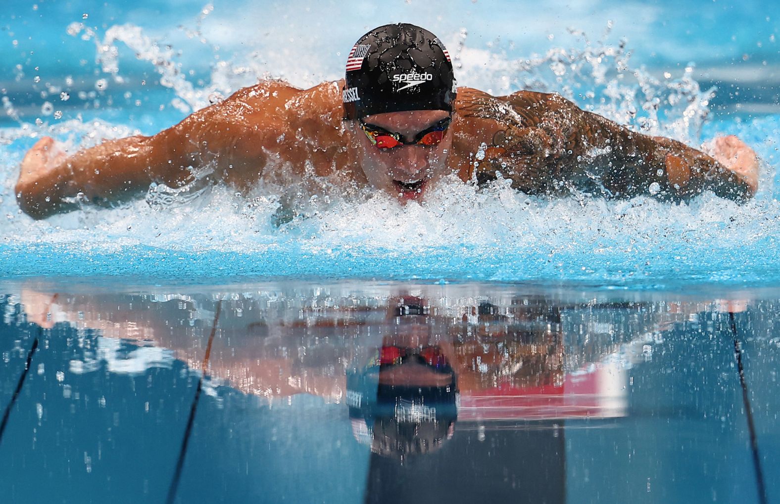 American swimmer Caeleb Dressel competes in the 100-meter butterfly on July 31. He finished in 49.45 seconds, <a href="index.php?page=&url=https%3A%2F%2Fwww.cnn.com%2Fworld%2Flive-news%2Ftokyo-2020-olympics-07-30-21-spt%2Fh_4199d75e43fa3fccdfcca6cb47520ebf" target="_blank">winning gold and breaking his own world record in the process.</a>
