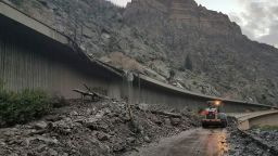 In this photo provided by the Colorado Department of Transportation, equipment works to clear mud and debris from the mudslide on I-70.