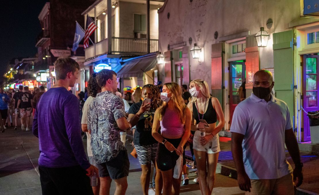 Emma Walton and Maddison Mansfield of Little Rock, Arkansas, walk down Bourbon Street in New Orleans.