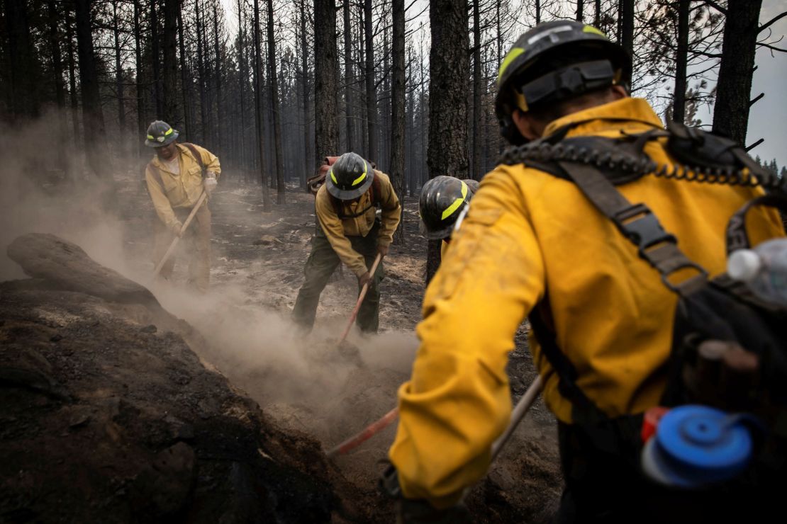 Firefighters from New Mexico work amidst heavy ash and dust to help contain the Bootleg Fire near Silver Lake, Oregon, on July 29, 2021. 