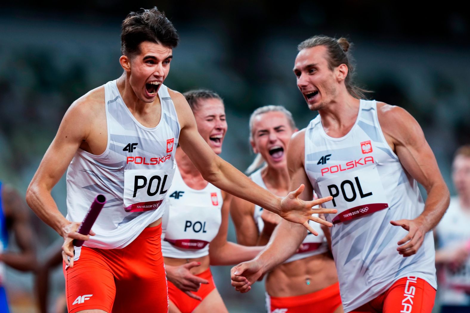 Poland won <a href="index.php?page=&url=https%3A%2F%2Fwww.cnn.com%2Fworld%2Flive-news%2Ftokyo-2020-olympics-07-31-21-spt%2Fh_0ca9ae0e1fbae06e5f1ca145f2e28674" target="_blank">the Olympics' first-ever mixed relay in the 4x400 meters.</a> From left are Kajetan Duszynski, Natalia Kaczmarek, Justyna Swiety-Ersetic and Karol Zalewski.