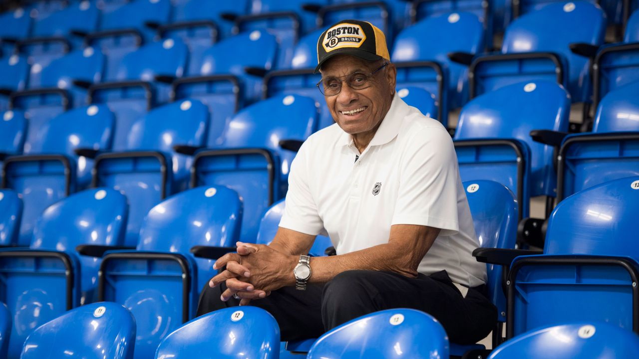 In this June 22, 2017, photo, Willie O'Ree, known best for being the first black player in the National Hockey League, poses for a photo in the Willie O'Ree Place in Fredericton, New Brunswick, Canada. 