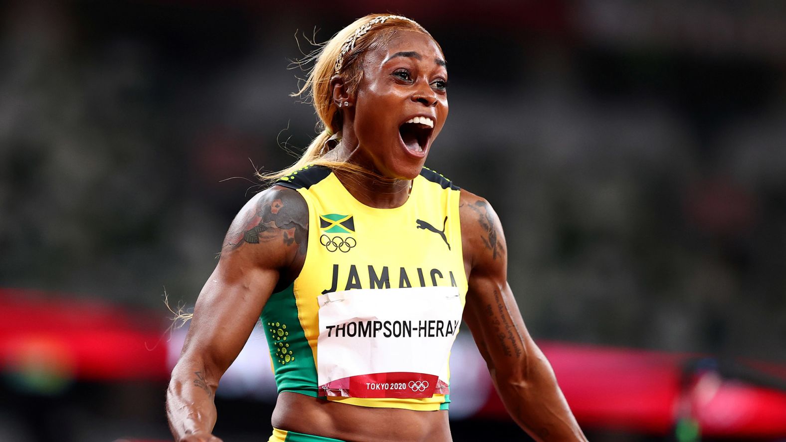 Jamaican sprinter Elaine Thompson-Herah celebrates after <a href="index.php?page=&url=https%3A%2F%2Fwww.cnn.com%2Fworld%2Flive-news%2Ftokyo-2020-olympics-07-31-21-spt%2Fh_fad429aba3c7d06c0e4de7fd7b3973ba" target="_blank">winning gold in the 100-meter dash</a> on July 31. She set an Olympic record time of 10.61 seconds as she defended her title from 2016.