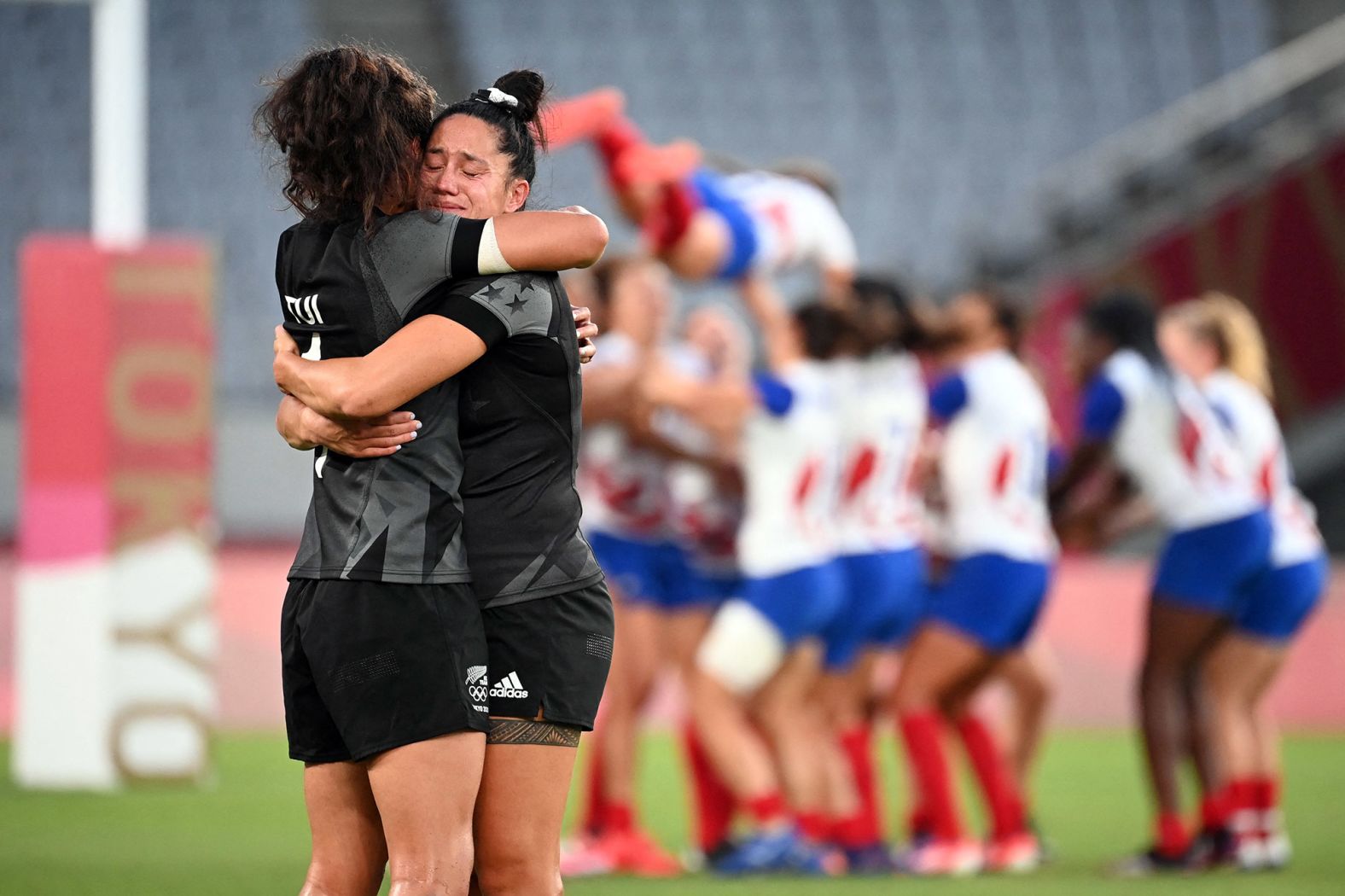 Members of New Zealand's rugby team hug after defeating France <a href="index.php?page=&url=https%3A%2F%2Fwww.cnn.com%2Fworld%2Flive-news%2Ftokyo-2020-olympics-07-31-21-spt%2Fh_c290ab55510bd8ce401aa12537d8b410" target="_blank">to win gold</a> on July 31.