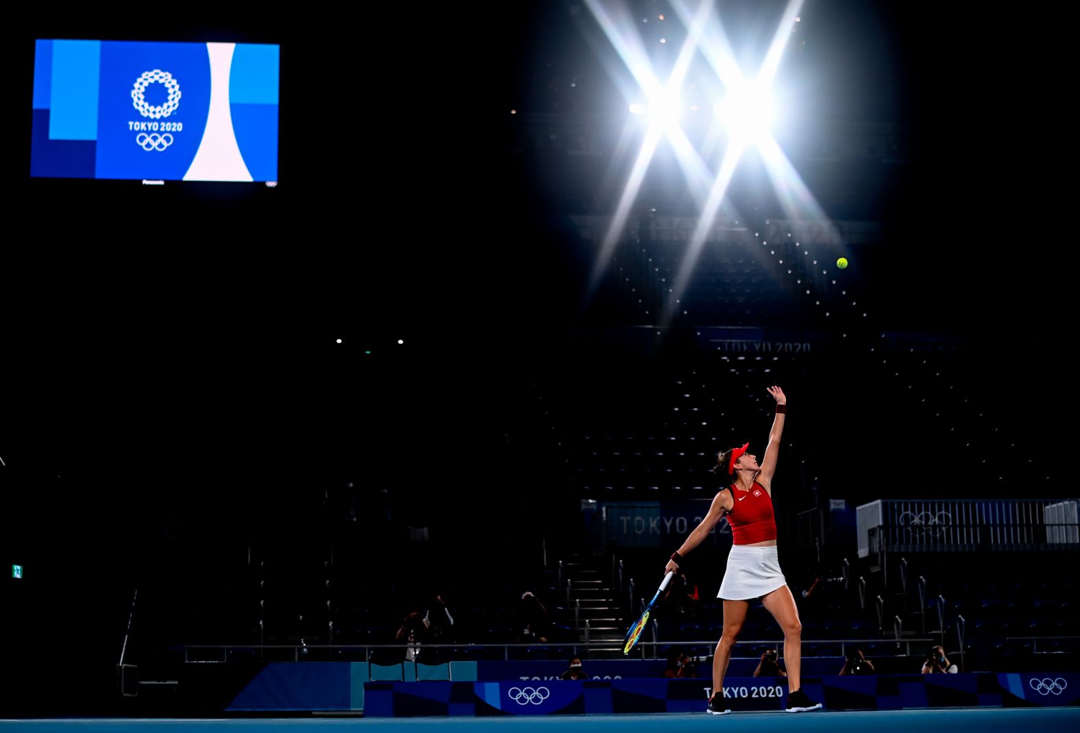 Switzerland's Belinda Bencic serves to the Czech Republic's Marketa Vondrousova during the gold-medal tennis match on July 31. Bencic won 7-5, 2-6, 6-3.