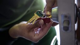 An apartment maintenance man changes the lock of an apartment after constables posted an eviction order on October 7, 2020 in Phoenix, Arizona. Thousands of court-ordered evictions continue nationwide despite a Centers for Disease Control (CDC) moratorium for renters impacted by the coronavirus pandemic. 