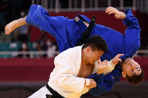 Japan's Shoichiro Mukai, left, and Germany's Eduard Trippel compete in team judo on July 31.