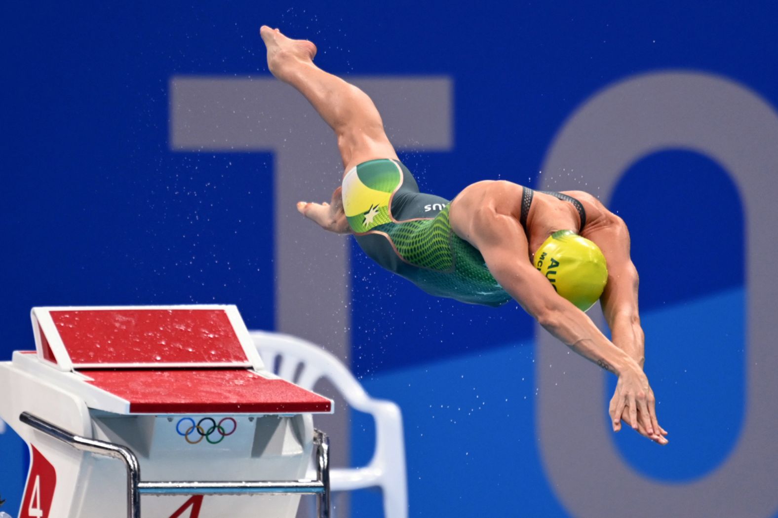 Australian swimmer Emma McKeon dives into the pool at the start of the 50-meter freestyle final on August 1. <a href="index.php?page=&url=https%3A%2F%2Fwww.cnn.com%2Fworld%2Flive-news%2Ftokyo-2020-olympics-07-31-21-spt%2Fh_a446974be9f9f42dd484d438fdc1f426" target="_blank">She won her third gold in Tokyo</a> and set an Olympic record time of 23.81 seconds.