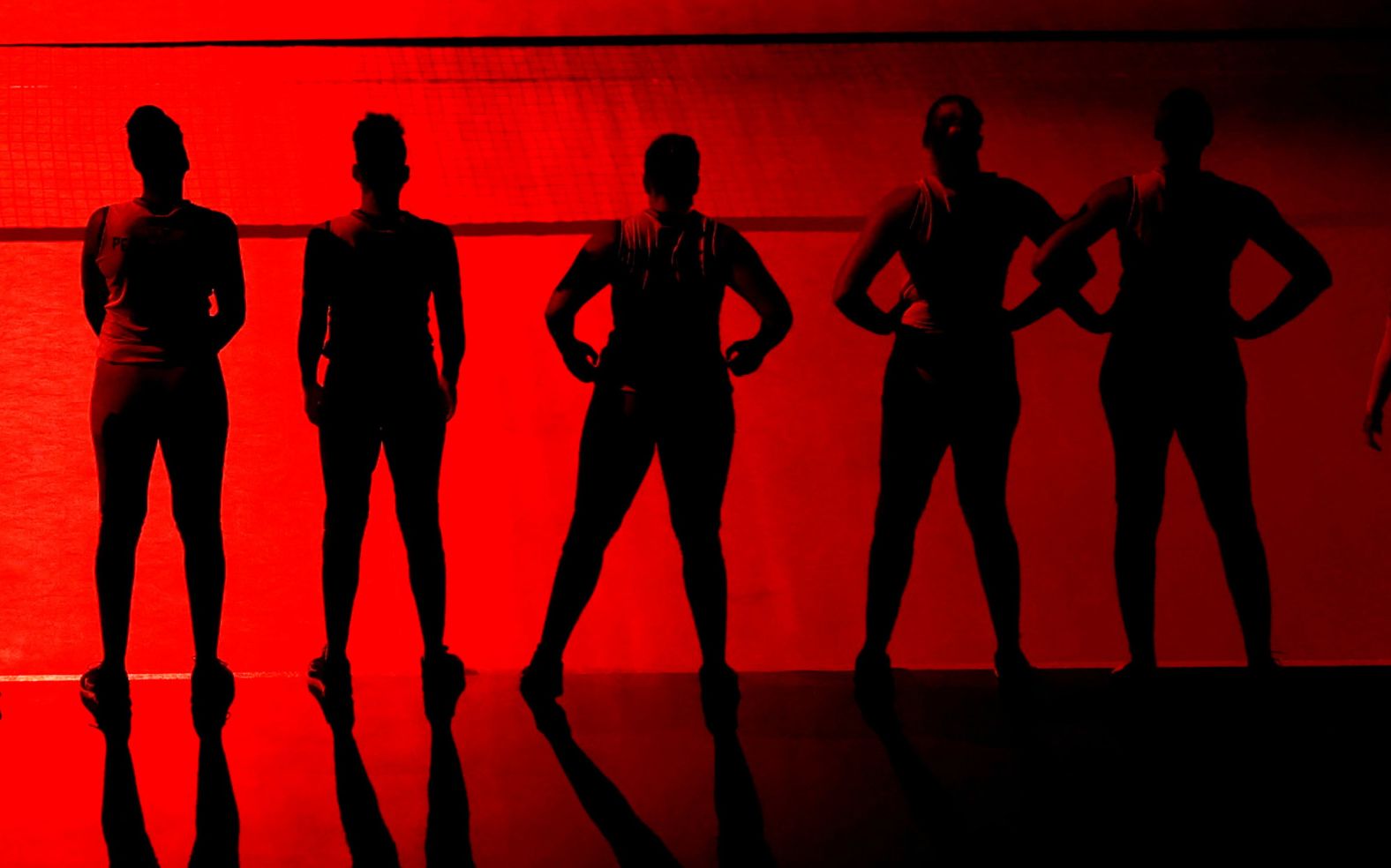 Members of the Dominican Republic's volleyball team line up before a match against Kenya on July 31.