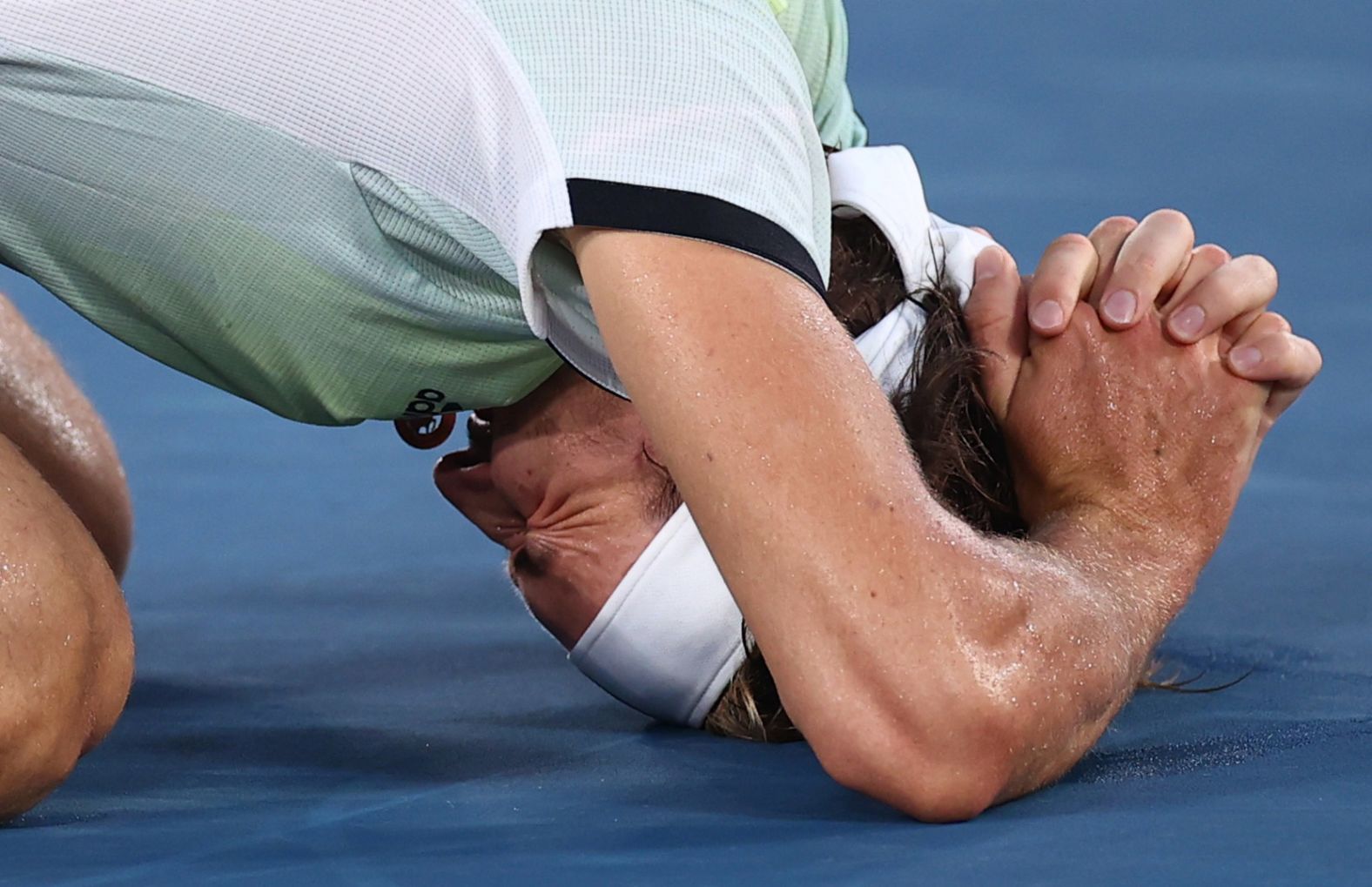 Germany's Alexander Zverev reacts after <a href="index.php?page=&url=https%3A%2F%2Fwww.cnn.com%2Fworld%2Flive-news%2Ftokyo-2020-olympics-08-01-21-spt%2Fh_2399c259ddcbd7c3811fb5fc9da62c03" target="_blank">winning his gold-medal tennis match</a> on August 1. He defeated Russian Karen Khachanov 6-3, 6-1.