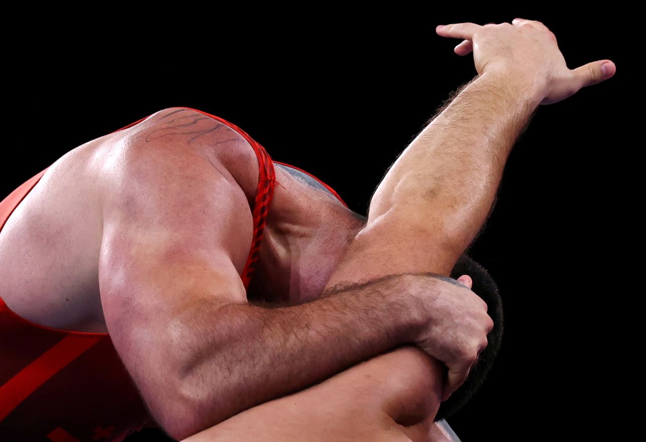 Georgia's Iakobi Kajaia, left, takes on Russian Sergei Semenov in a Greco-Roman wrestling quarterfinal on August 1. Kajaia went on to win a silver medal.