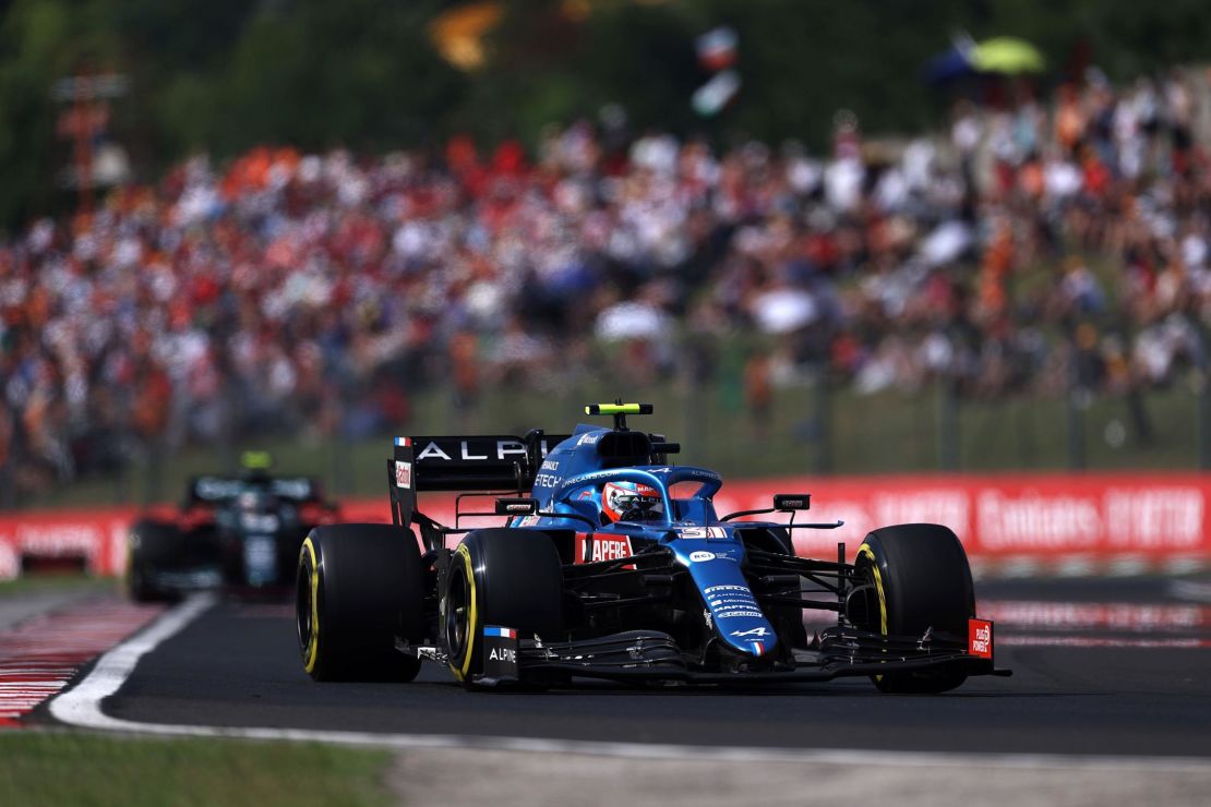 After the race restarted, Alpine's Ocon defended his lead from Aston Martin's Sebastian Vettel to claim the first F1 victory of his career.