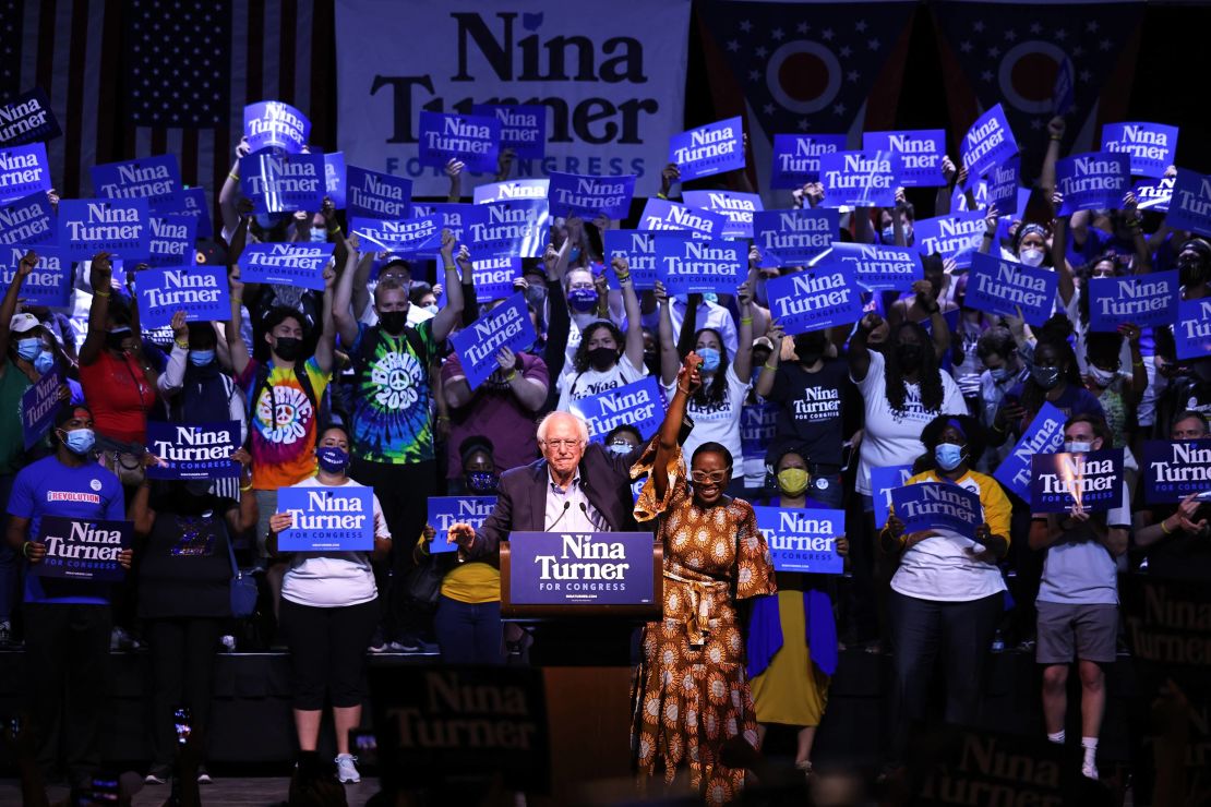 Sen. Bernie Sanders (I-VT) raises the hand of Ohio 11th District congressional candidate Nina Turner during a Get Out the Vote rally at Agora Theater & Ballroom on July 31, 2021 in Cleveland, Ohio. 
