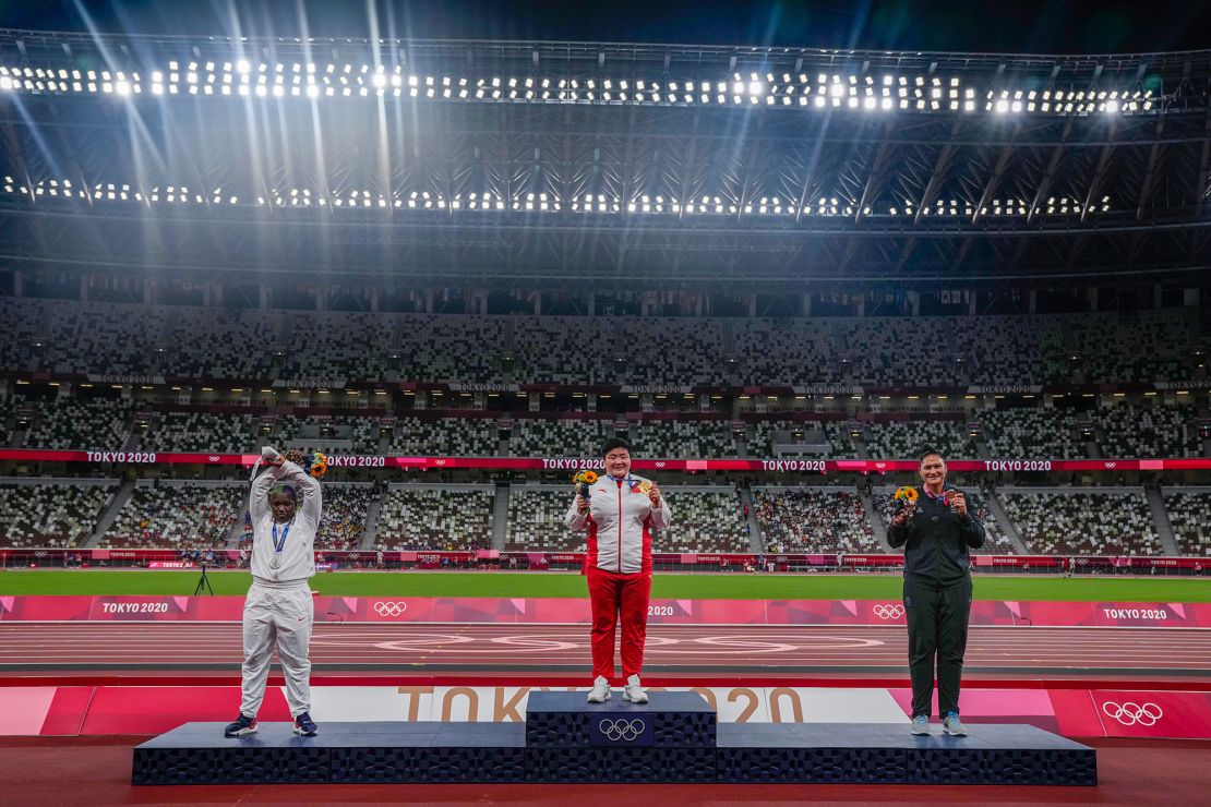 Saunders performing her X gesture on the shot put medal podium.