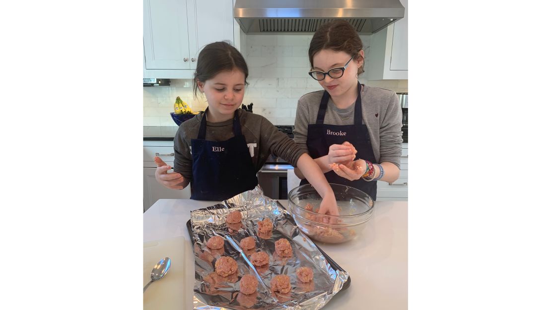 Making turkey meatballs is not that different from rolling balls of Play-Doh.