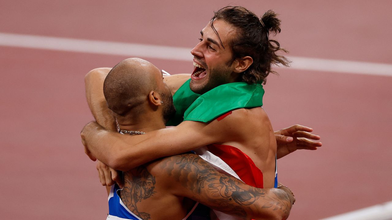 Jacobs (left) and Tamberi embrace  after the men's 100m final.