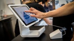 A customer uses a Square Inc. device to make a payment in San Francisco, California, U.S., on Tuesday, March 27, 2018. The mobile payment market is anticipated to grow reaching a market value of $4,574 billion by 2023, according to data provided by Allied Market Research (AMR). The growth projections are attributed to an increasing demand for hassle-free purchase of goods and services, as well as an increased preference of consumers toward digital and cashless payments. Photographer: David Paul Morris/Bloomberg via Getty Images