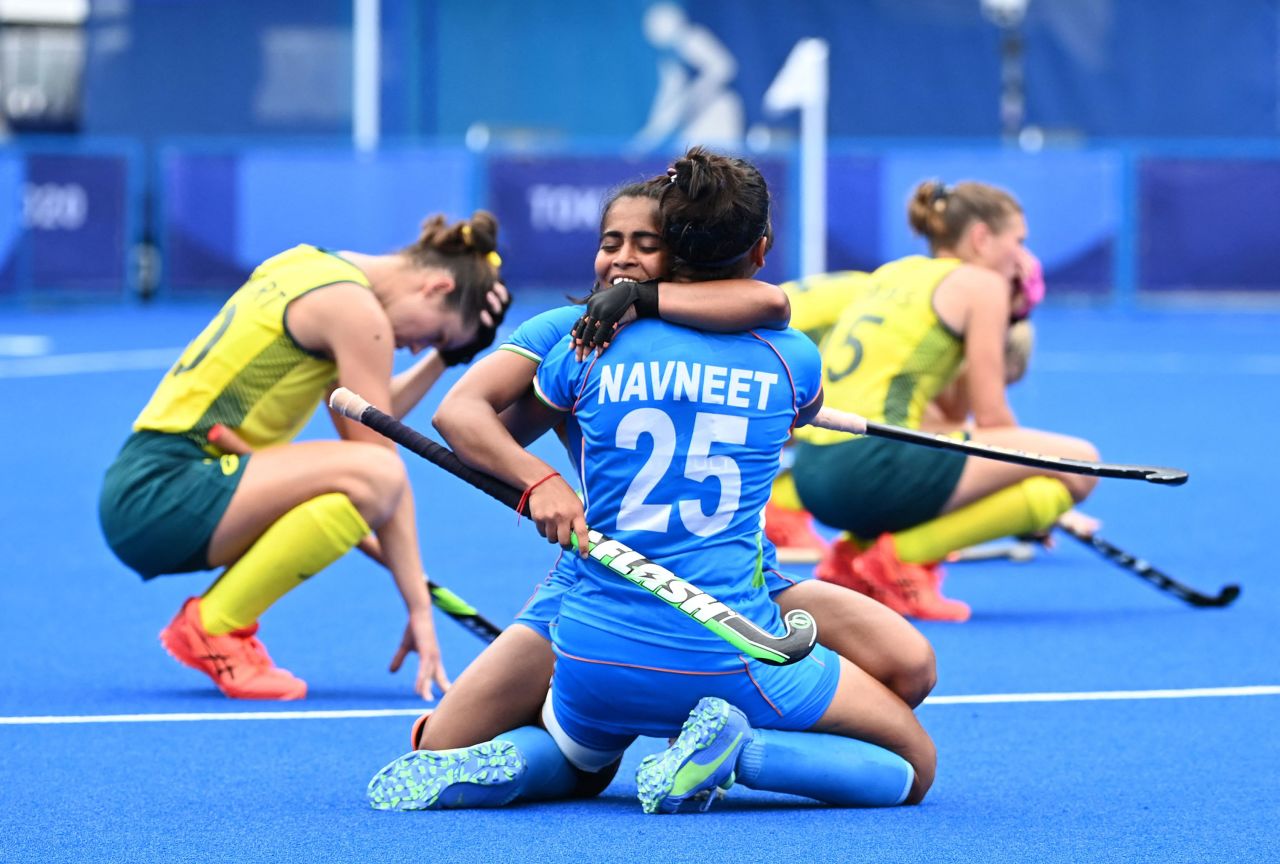 India's Neha Goyal embraces Navneet Kaur after a 1-0 win over Australia in a field hockey quarterfinal on August 2.