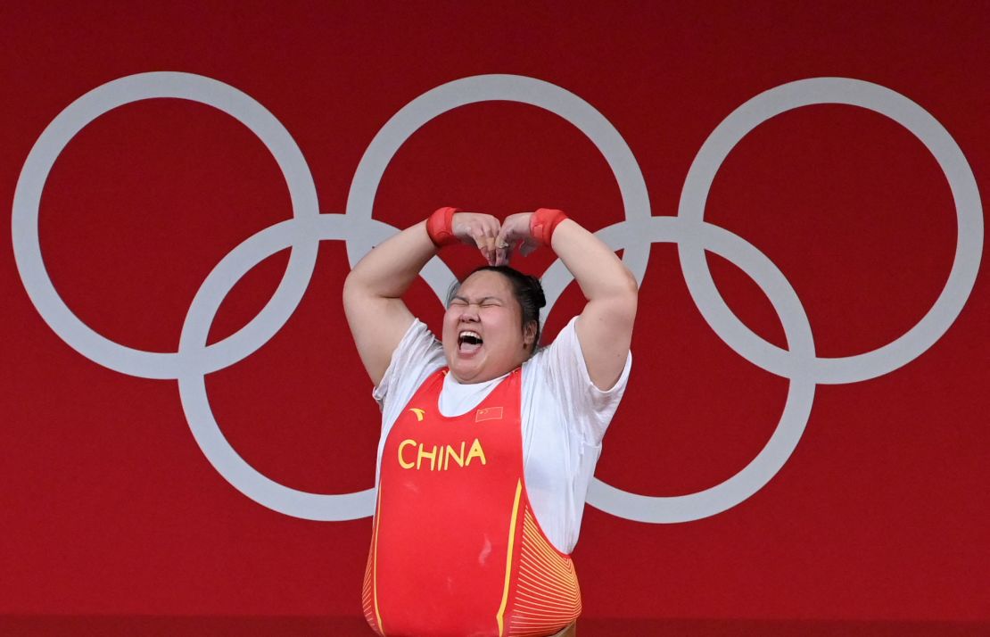 Li Wenwen celebrates during the women's +87kg weightlifting competition at the Tokyo Olympics.