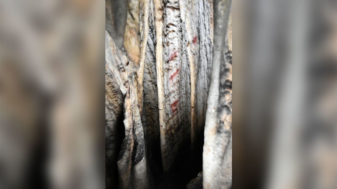 Here is a close-up view of one of the curtains with red markings in Cueva de Ardales.
