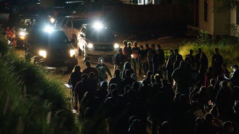 United States Border Patrol agents process migrants who crossed the US-Mexico border into the United States in Roma, Texas, on July 9, 2021.