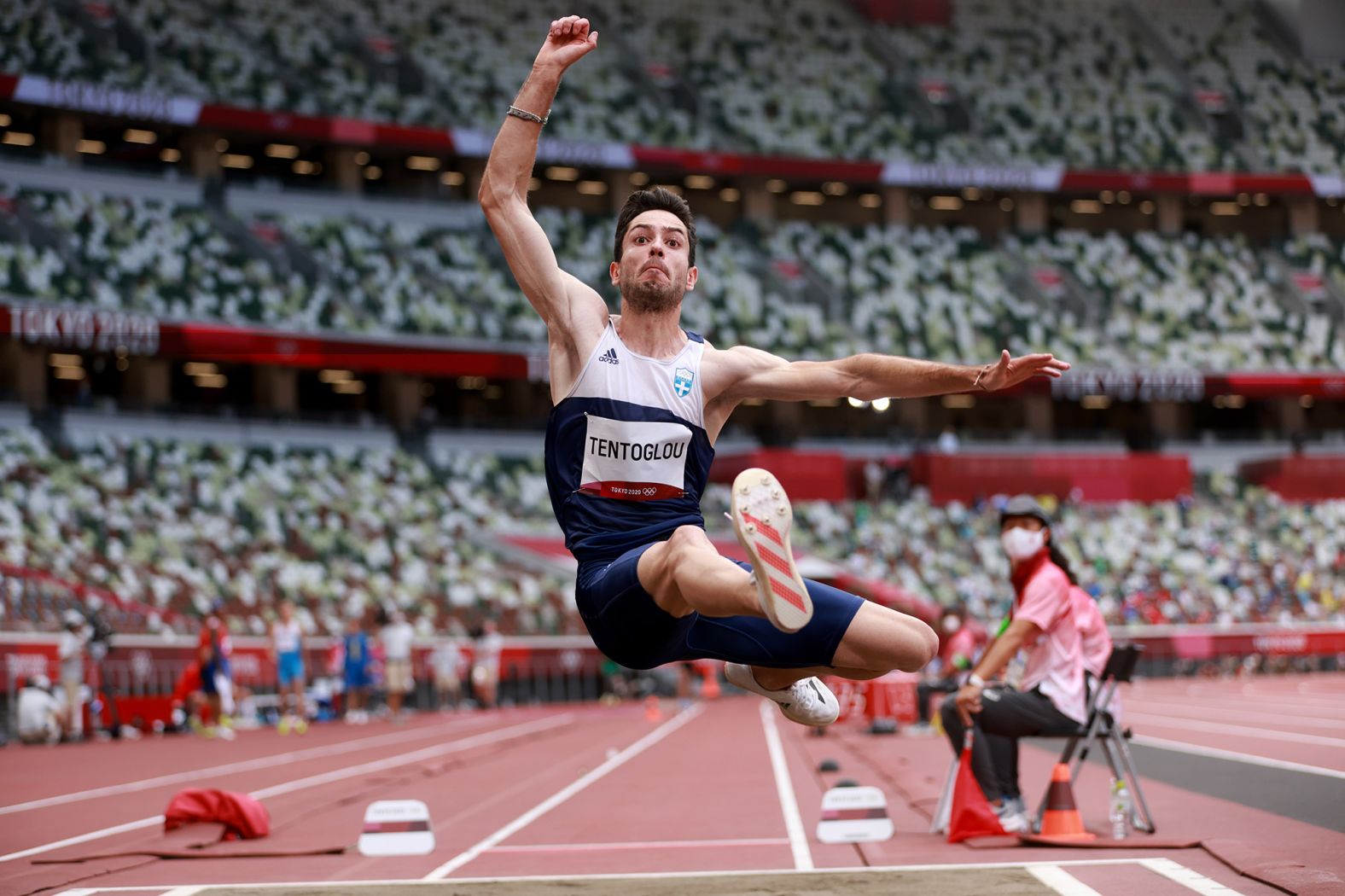 Greece's Miltiadis Tentoglou competes in the long jump on August 2. Both he and Cuba's Juan Miguel Echevarria had a top jump of 8.41 meters, but <a href="index.php?page=&url=https%3A%2F%2Fwww.cnn.com%2Fworld%2Flive-news%2Ftokyo-2020-olympics-08-01-21-spt%2Fh_e020f618747e2ab11a985a7728bfc2e8" target="_blank">Tentoglou won the gold medal</a> because his second-best jump was longer than Echevarria's.