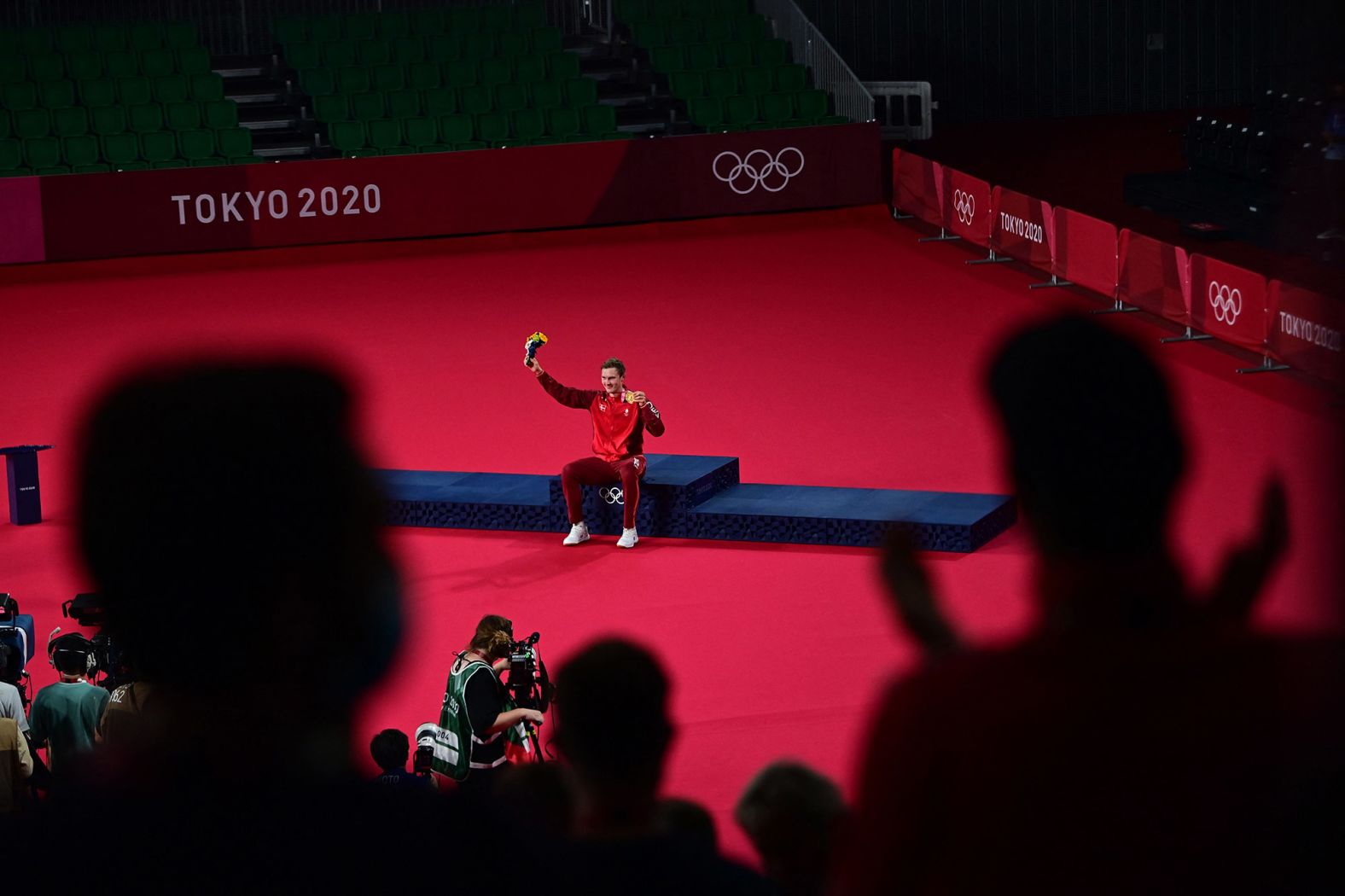 Denmark's Viktor Axelsen is applauded after receiving his <a href="https://www.cnn.com/world/live-news/tokyo-2020-olympics-08-02-21-spt/h_9eeee5368bdc8f9a5ecb35b3a3a125fc" target="_blank">badminton gold medal</a> on Monday, August 2. He is the first player from outside of Asia to win Olympic gold in men's singles in more than 20 years.