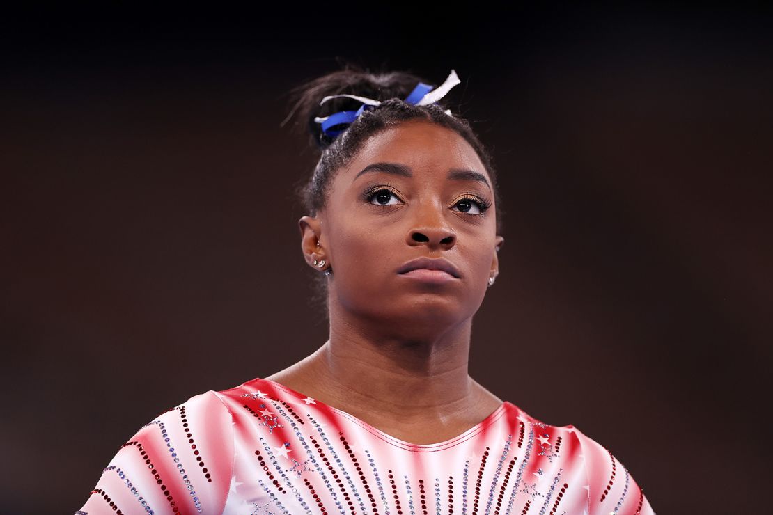 Biles looks on during warm-ups prior to the women's balance beam final.
